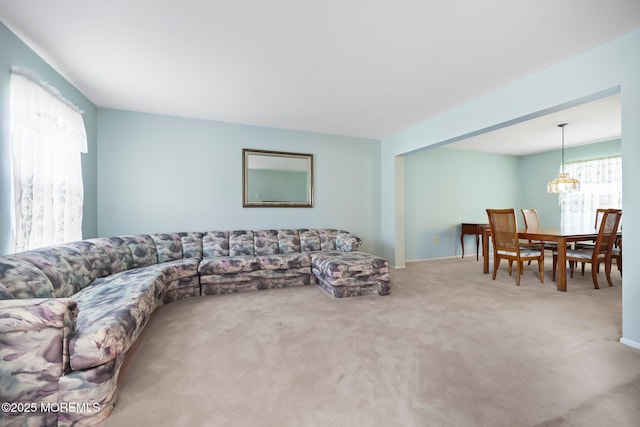 57 High Pointe Way, Matawan, NJ 07747 - living area with a chandelier and carpet