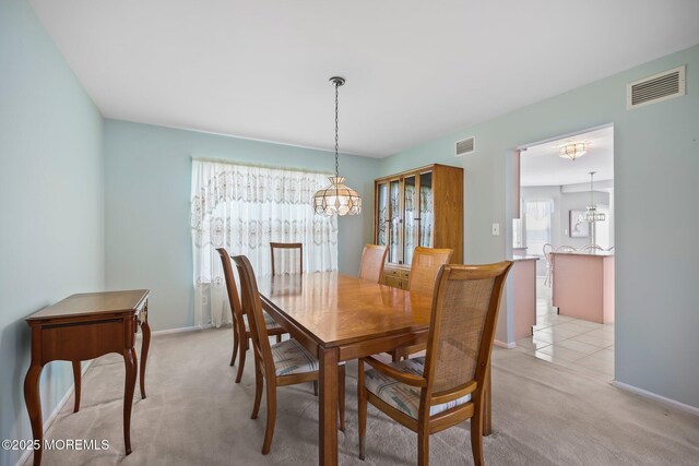 57 High Pointe Way, Matawan, NJ 07747 - dining area with a chandelier and light colored carpet