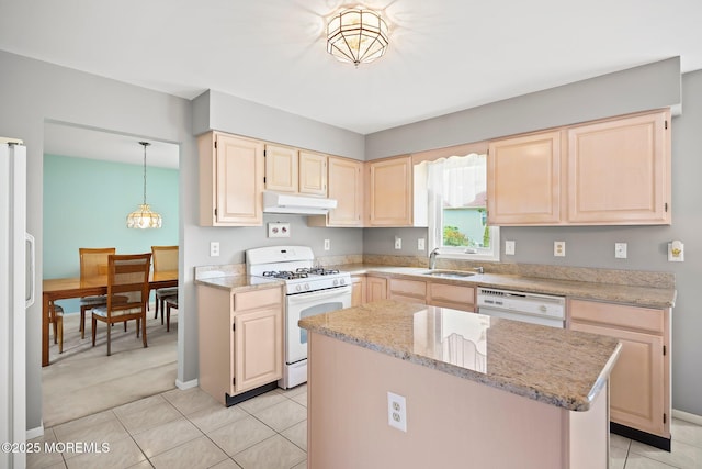 57 High Pointe Way, Matawan, NJ 07747 - kitchen with white appliances, under cabinet range hood, light brown cabinetry, a center island, and light tile patterned floors