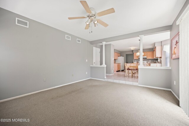 57 High Pointe Way, Matawan, NJ 07747 - unfurnished living room featuring light colored carpet, ceiling fan, and decorative columns