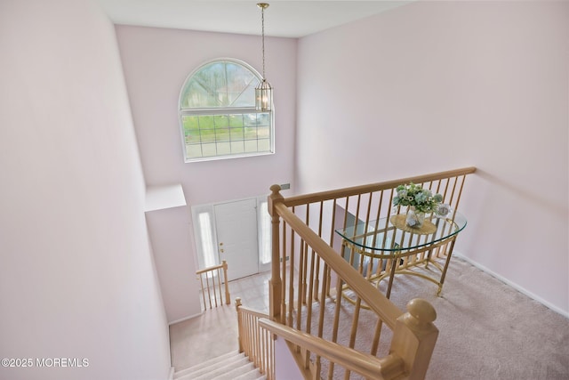 57 High Pointe Way, Matawan, NJ 07747 - staircase with carpet floors and a chandelier