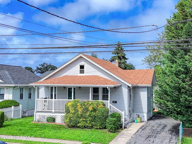 198 W Sylvania Ave, Neptune City, NJ 07753 - bungalow-style home featuring covered porch, roof with shingles, and a chimney