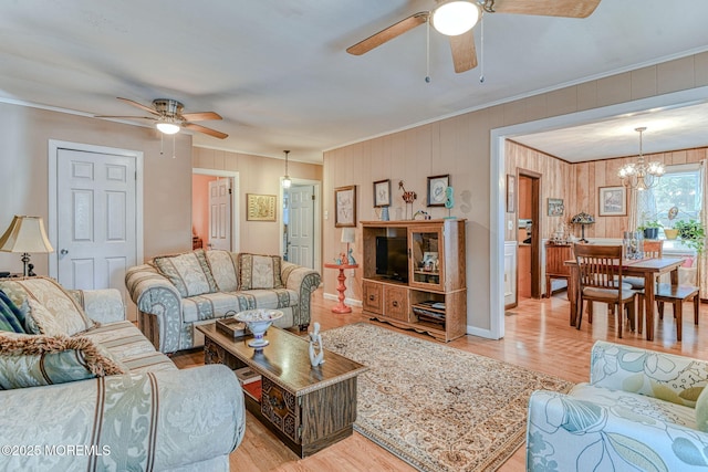 198 W Sylvania Ave, Neptune City, NJ 07753 - living room with ceiling fan, ornamental molding, wood finished floors, a chandelier, and wood walls