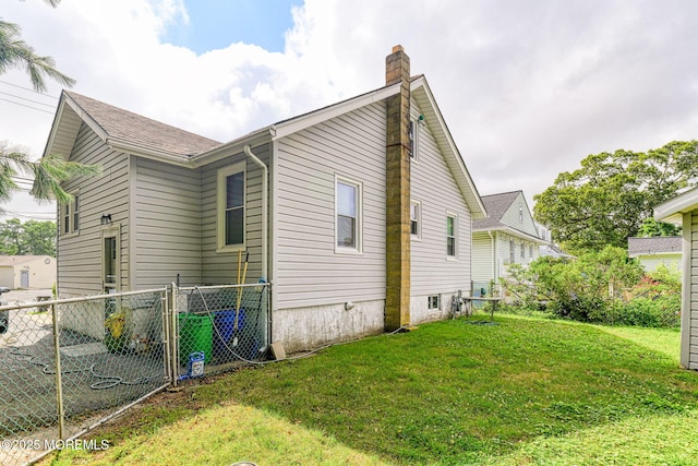 198 W Sylvania Ave, Neptune City, NJ 07753 - view of side of home featuring a chimney and a gate