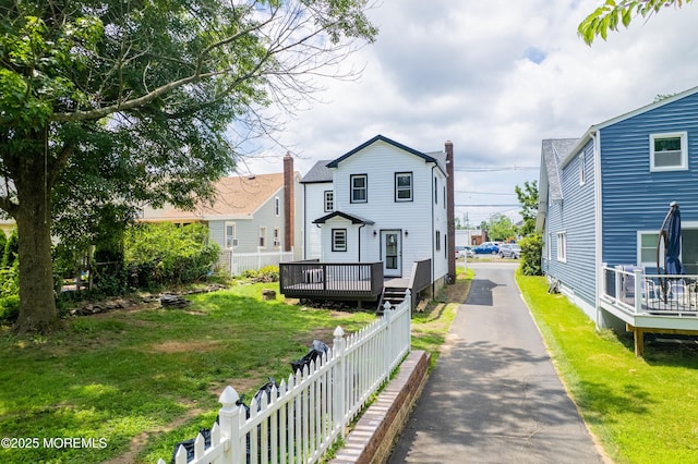 101 Broad St, Matawan, NJ 07747 - rear view of property featuring asphalt driveway and a wooden deck