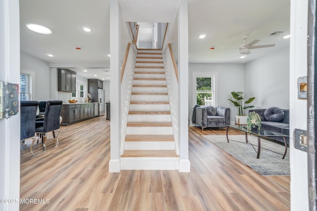 101 Broad St, Matawan, NJ 07747 - stairway with a ceiling fan, wood finished floors, and recessed lighting