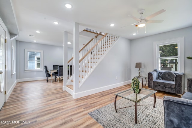 101 Broad St, Matawan, NJ 07747 - living room with healthy amount of natural light, stairway, light wood-type flooring, and recessed lighting