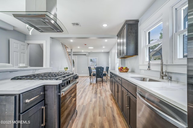 101 Broad St, Matawan, NJ 07747 - kitchen with appliances with stainless steel finishes, extractor fan, light wood-type flooring, light stone counters, and recessed lighting