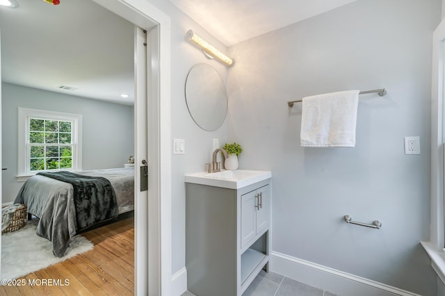 101 Broad St, Matawan, NJ 07747 - bathroom featuring ensuite bathroom, vanity, and wood finished floors
