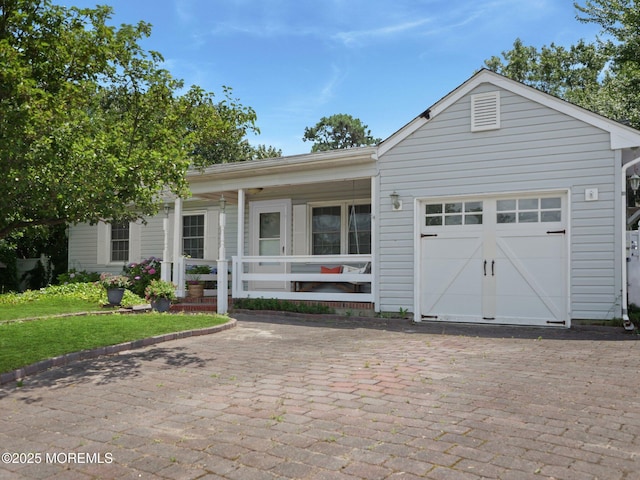 962 Columbus Dr, Brick, NJ 08724 - single story home featuring a porch, a garage, and decorative driveway