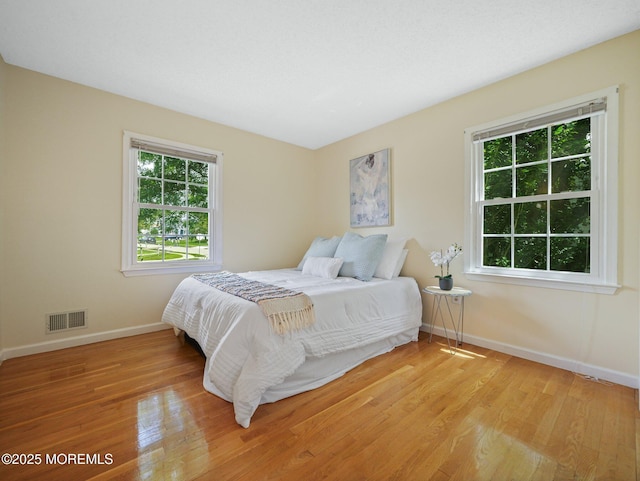 962 Columbus Dr, Brick, NJ 08724 - bedroom featuring multiple windows and light wood-style floors
