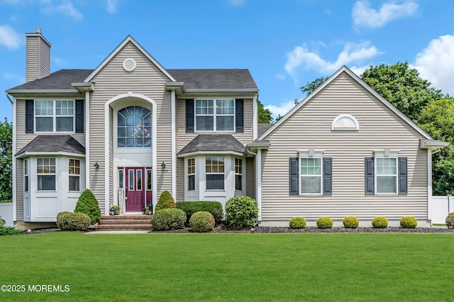 1667 Kalvel Ct, Toms River, NJ 08755 - view of front of home with a front yard and a chimney