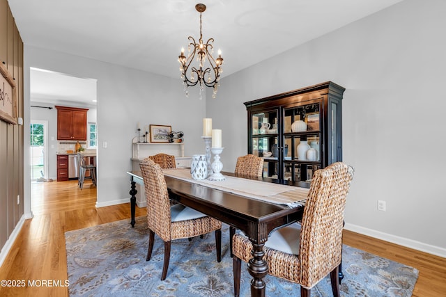 1667 Kalvel Ct, Toms River, NJ 08755 - dining space with a chandelier and light wood-type flooring