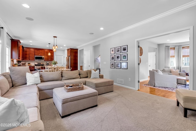 1667 Kalvel Ct, Toms River, NJ 08755 - living room featuring light carpet, recessed lighting, and crown molding