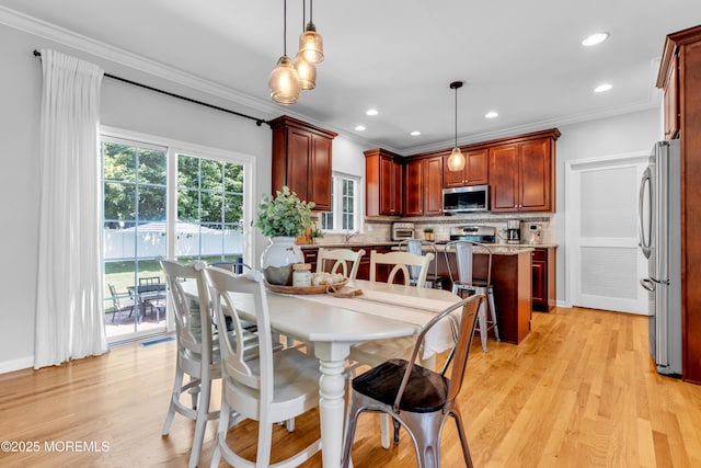 1667 Kalvel Ct, Toms River, NJ 08755 - dining space featuring crown molding, light wood-style floors, and recessed lighting