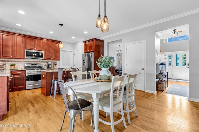 1667 Kalvel Ct, Toms River, NJ 08755 - dining room featuring light wood-type flooring, recessed lighting, a chandelier, and crown molding