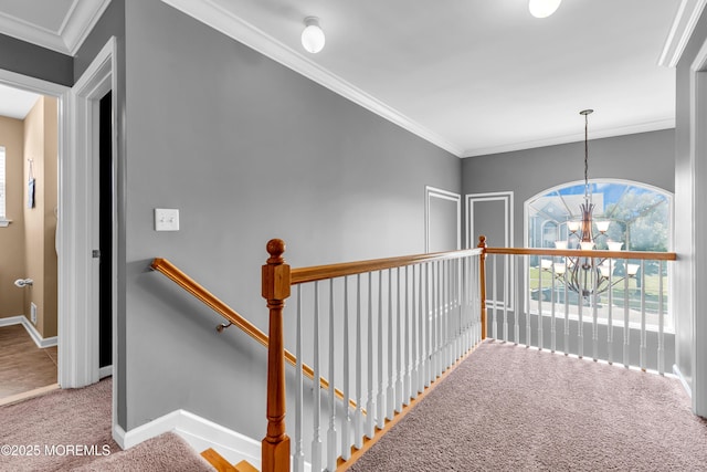 1667 Kalvel Ct, Toms River, NJ 08755 - hall featuring carpet floors, an upstairs landing, a chandelier, and crown molding