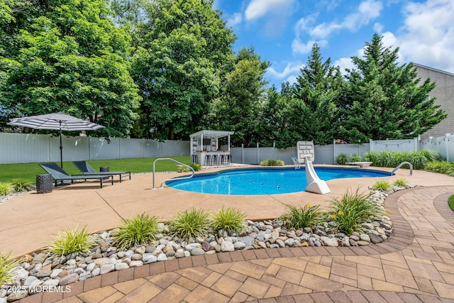 1667 Kalvel Ct, Toms River, NJ 08755 - view of swimming pool featuring a patio area, a fenced backyard, and a diving board