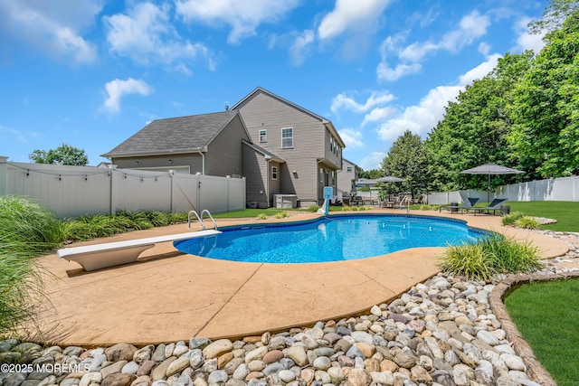1667 Kalvel Ct, Toms River, NJ 08755 - view of swimming pool with a fenced backyard, a diving board, and a patio area