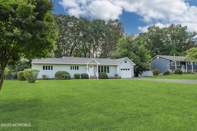 10 Locust Grove Ln, Manalapan, NJ 07726 - ranch-style home featuring an attached garage, asphalt driveway, and a front lawn