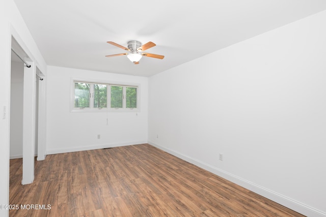 10 Locust Grove Ln, Manalapan, NJ 07726 - unfurnished bedroom with wood finished floors and a ceiling fan