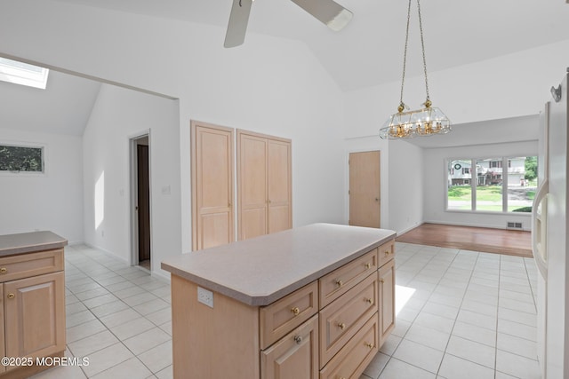 10 Locust Grove Ln, Manalapan, NJ 07726 - kitchen featuring light brown cabinets, light tile patterned floors, and high vaulted ceiling