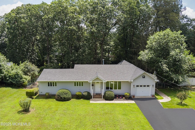 10 Locust Grove Ln, Manalapan, NJ 07726 - ranch-style house featuring a garage, asphalt driveway, and a front lawn