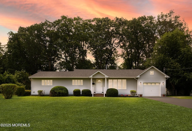 10 Locust Grove Ln, Manalapan, NJ 07726 - single story home with a garage, a front lawn, and asphalt driveway