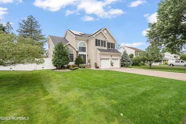 95 Linden Ave, West Long Branch, NJ 07764 - traditional-style house with an attached garage, concrete driveway, and roof mounted solar panels
