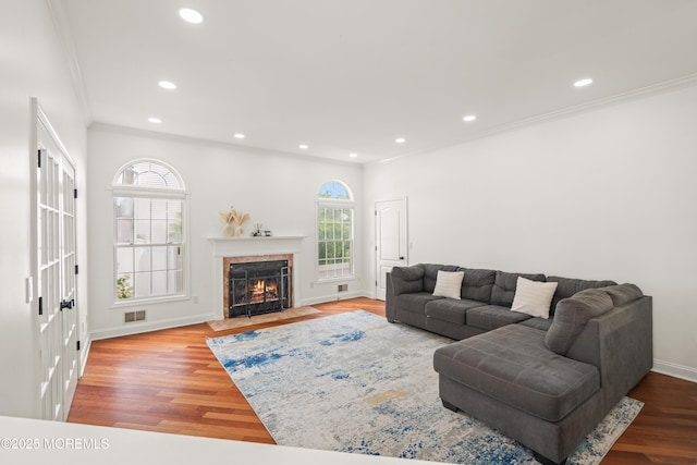 95 Linden Ave, West Long Branch, NJ 07764 - living room with healthy amount of natural light, ornamental molding, wood finished floors, a fireplace with flush hearth, and recessed lighting