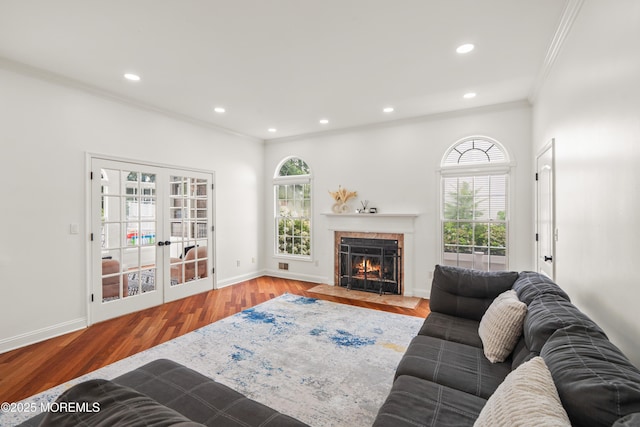 95 Linden Ave, West Long Branch, NJ 07764 - living area featuring crown molding, wood finished floors, a fireplace with flush hearth, recessed lighting, and french doors