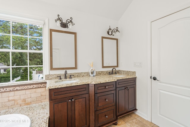 95 Linden Ave, West Long Branch, NJ 07764 - bathroom with double vanity, lofted ceiling, a garden tub, and tile patterned floors