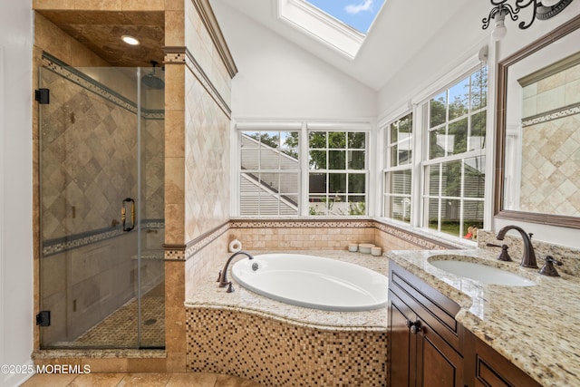 95 Linden Ave, West Long Branch, NJ 07764 - full bathroom with vaulted ceiling, vanity, a bath, a skylight, and a stall shower