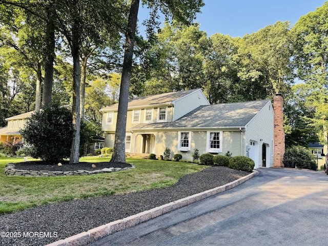 381 Buchanan Blvd, Red Bank, NJ 07701 - view of front of home with driveway, a front yard, and a chimney