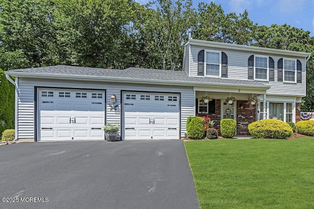 8 Yellowstone Ln, Howell, NJ 07731 - view of front of home with a front yard, a garage, driveway, and a porch