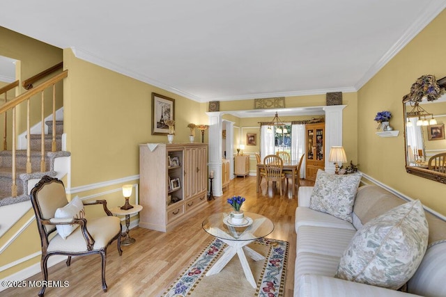 8 Yellowstone Ln, Howell, NJ 07731 - living area featuring wood finished floors, stairway, ornamental molding, ornate columns, and a chandelier