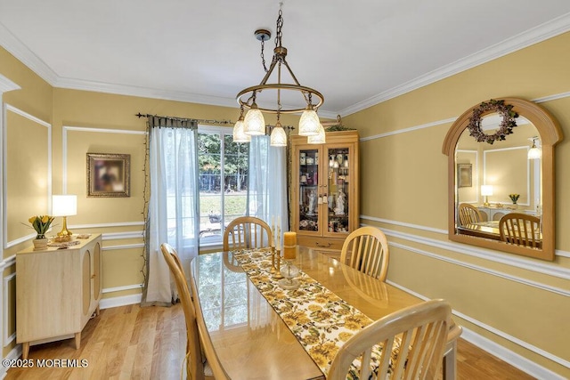 8 Yellowstone Ln, Howell, NJ 07731 - dining space with light wood finished floors, ornamental molding, and arched walkways