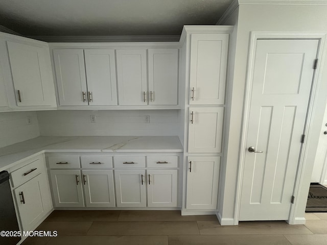 191 US Highway 9 Unit 14, Englishtown, NJ 07726 - kitchen with white cabinetry, light stone countertops, and decorative backsplash