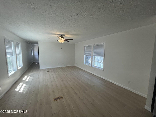 191 US Highway 9 Unit 14, Englishtown, NJ 07726 - unfurnished room with wood finished floors, a textured ceiling, a ceiling fan, and ornamental molding