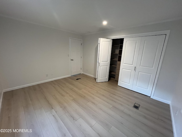 191 US Highway 9 Unit 14, Englishtown, NJ 07726 - unfurnished bedroom with light wood-type flooring and a closet