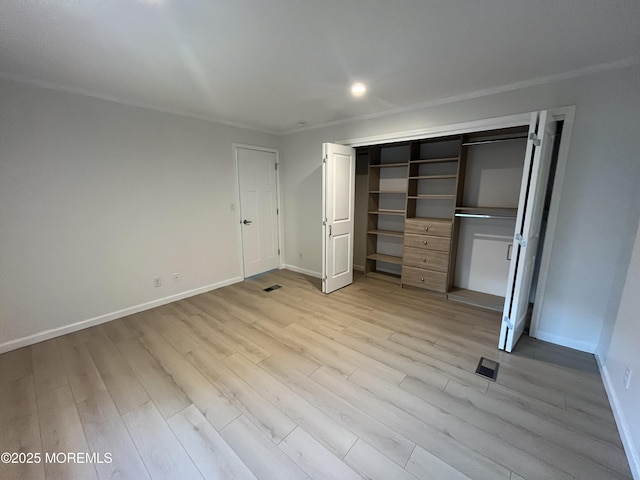 191 US Highway 9 Unit 14, Englishtown, NJ 07726 - unfurnished bedroom featuring light wood-style flooring and a closet