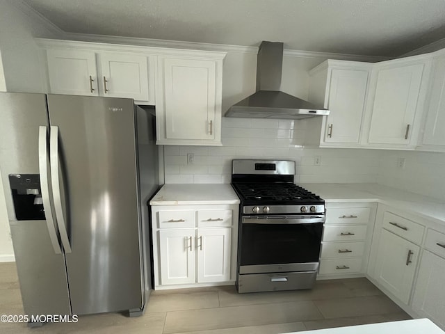 191 US Highway 9 Unit 14, Englishtown, NJ 07726 - kitchen featuring appliances with stainless steel finishes, wall chimney range hood, white cabinets, light countertops, and ornamental molding