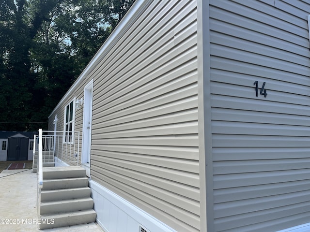 191 US Highway 9 Unit 14, Englishtown, NJ 07726 - view of home's exterior featuring a shed