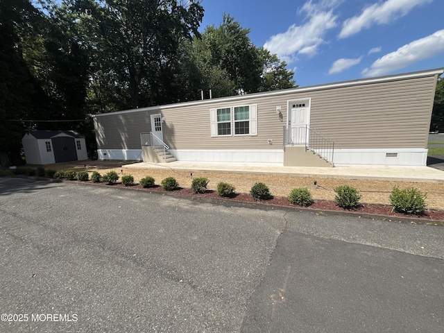 191 US Highway 9 Unit 14, Englishtown, NJ 07726 - manufactured / mobile home with entry steps and a storage unit