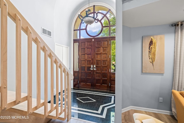 7 Wallace Ave, Oakhurst, NJ 07755 - foyer with a chandelier and wood finished floors