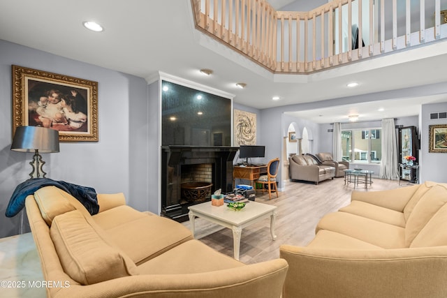 7 Wallace Ave, Oakhurst, NJ 07755 - living room with wood finished floors, a large fireplace, and recessed lighting