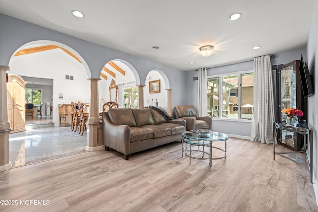 7 Wallace Ave, Oakhurst, NJ 07755 - living area with ornate columns, plenty of natural light, arched walkways, recessed lighting, and light wood finished floors