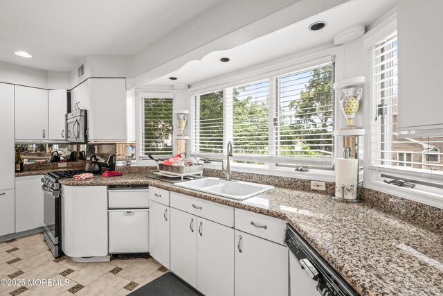 7 Wallace Ave, Oakhurst, NJ 07755 - kitchen featuring stainless steel appliances, white cabinetry, healthy amount of natural light, and recessed lighting