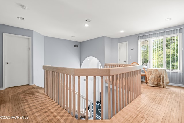 7 Wallace Ave, Oakhurst, NJ 07755 - hall featuring wood-type flooring, an upstairs landing, and recessed lighting