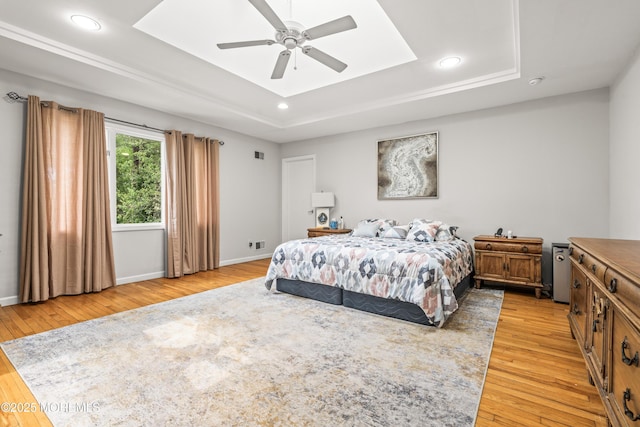 7 Wallace Ave, Oakhurst, NJ 07755 - bedroom featuring a tray ceiling, light wood-style floors, recessed lighting, and ceiling fan